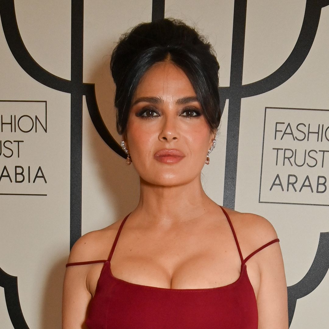 Salma Hayek's curvaceous figure looks phenomenal in extremely tight red dress