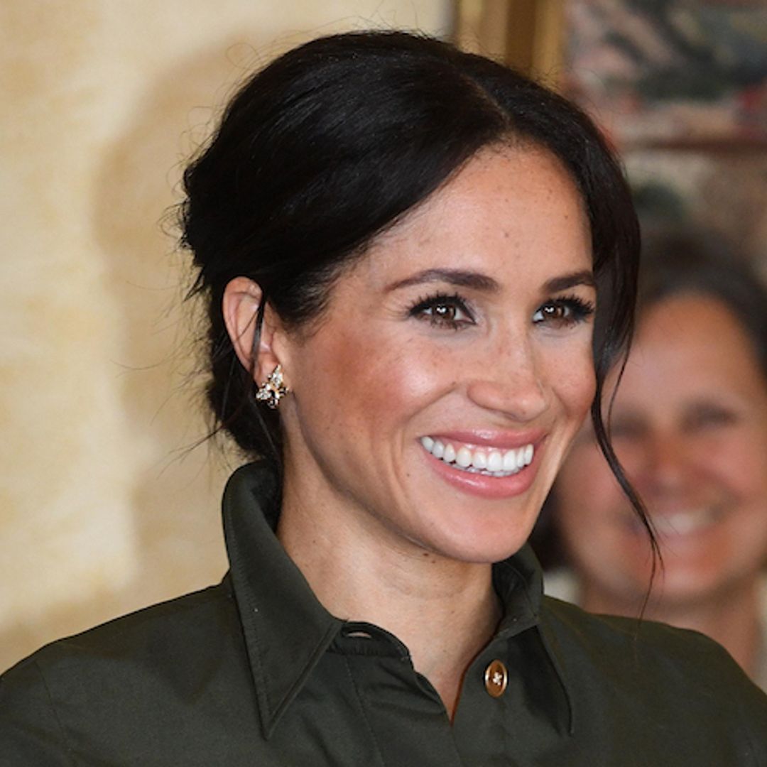 Outfit change! Duchess Meghan swaps to olive green shirt dress as first day of Australian visit comes to a close