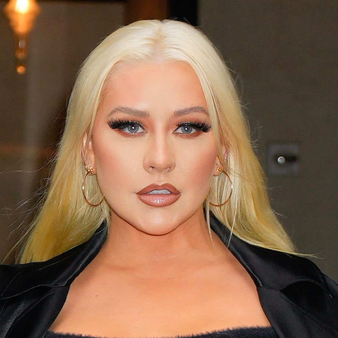 Christina Aguilera glows in leather look for rare family outing