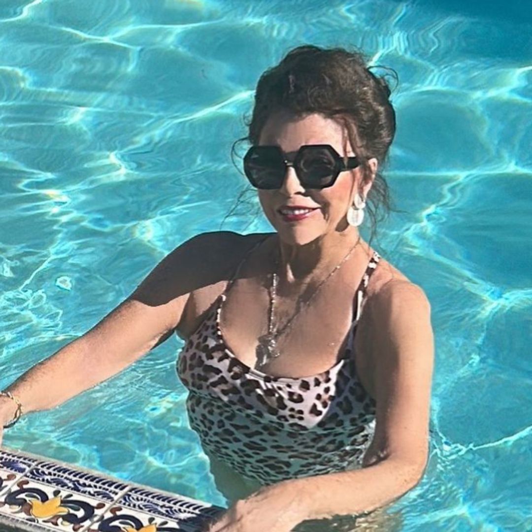 Joan Collins, 91, dances in plunging swimsuit during lavish holiday