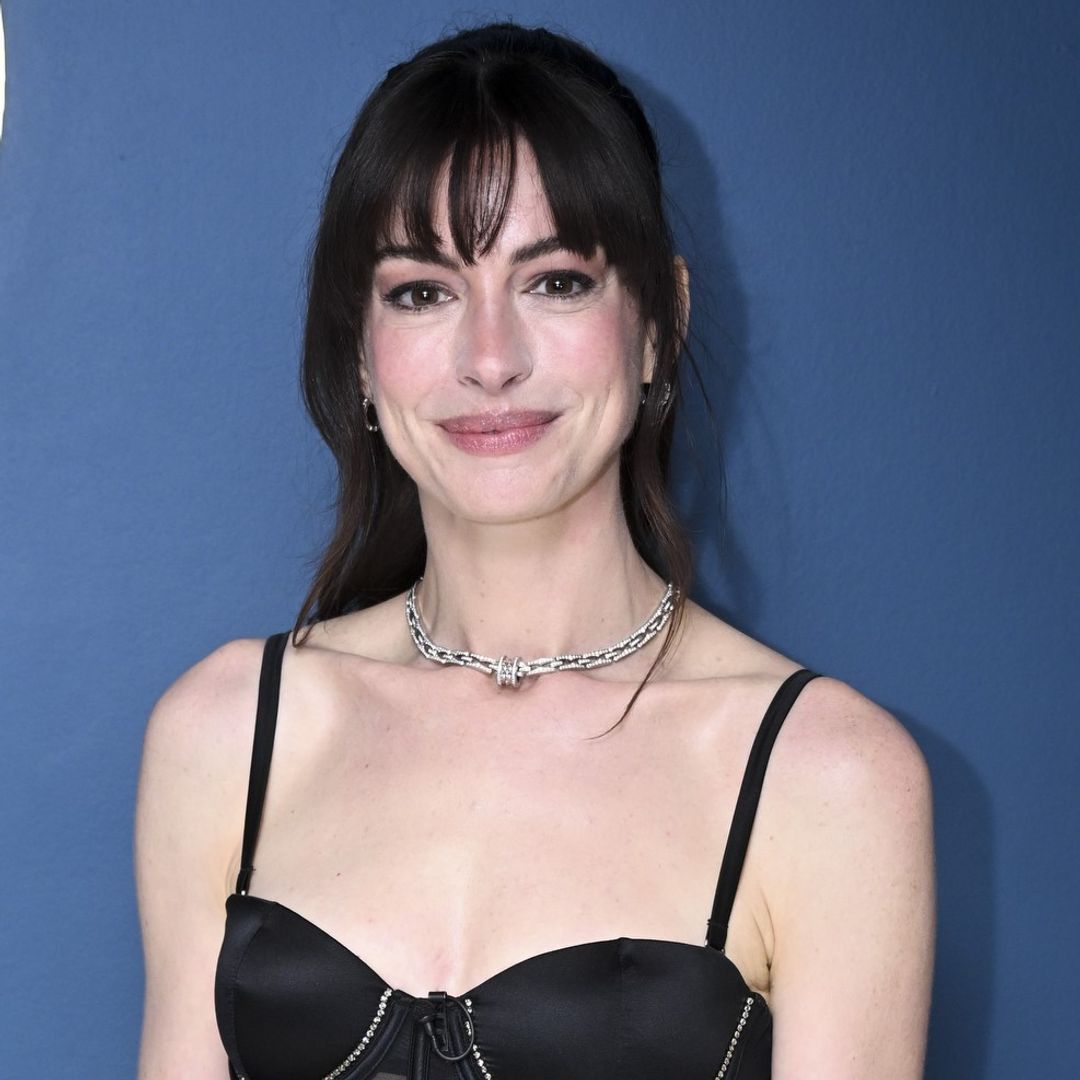 Anne Hathaway is sensational in totally unexpected corset and diamanté cargos