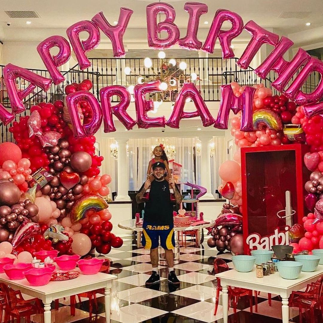 Rob Kardashian with his daughter Dream surrounded by pink birthday balloons