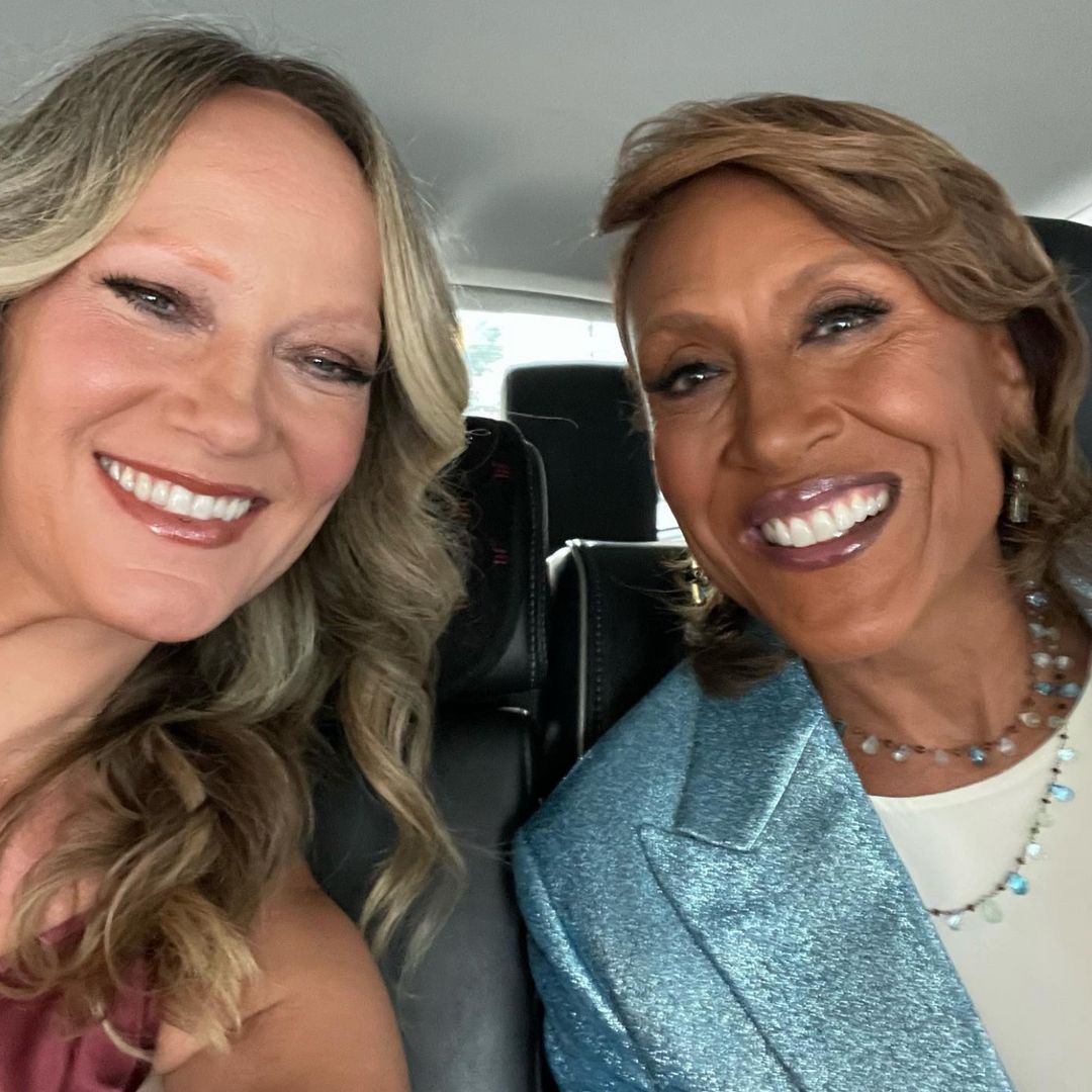 Robin Roberts smiling alongside partner Amber Laign in a car selfie