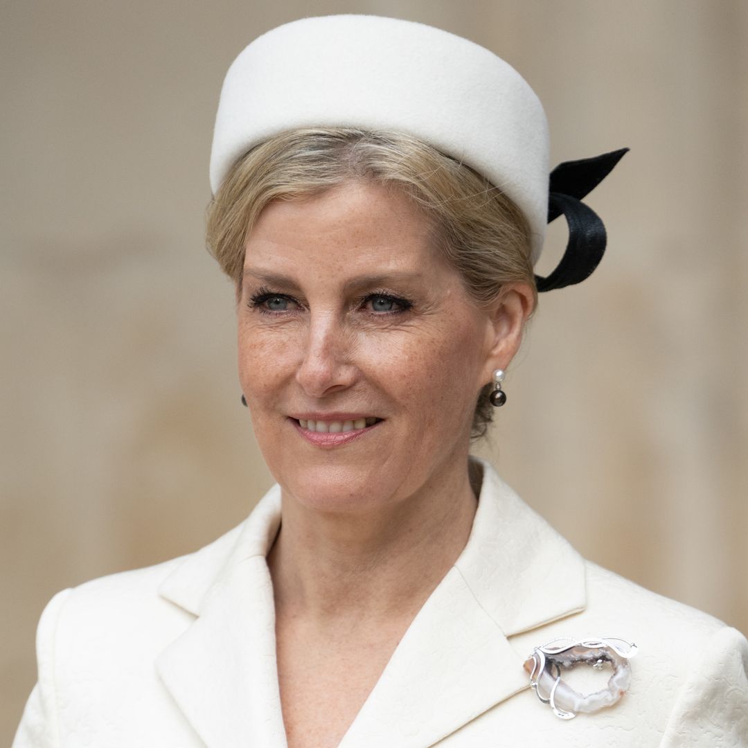 Duchess Sophie rocks brunette pixie cut and thigh split wedding guest skirt in unearthed photo