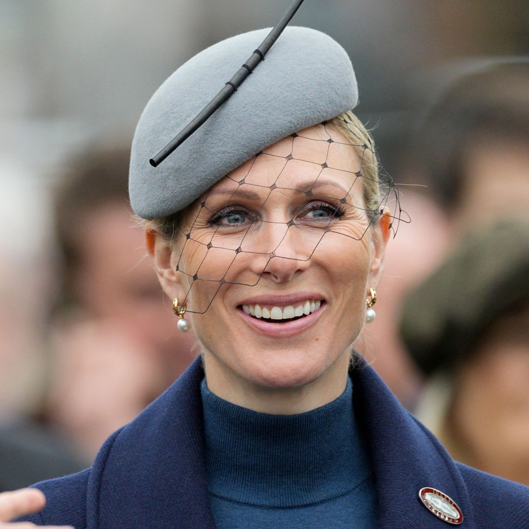 Zara Tindall nails race day glamour with extraordinary cape and plumed hat at Cheltenham Festival
