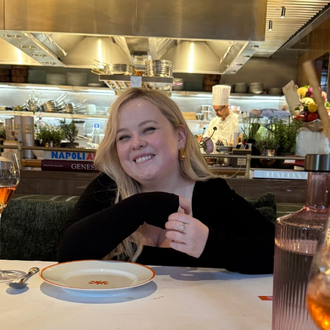 The Bridgerton actress nicola coughlan in a black dress at a restaurant 