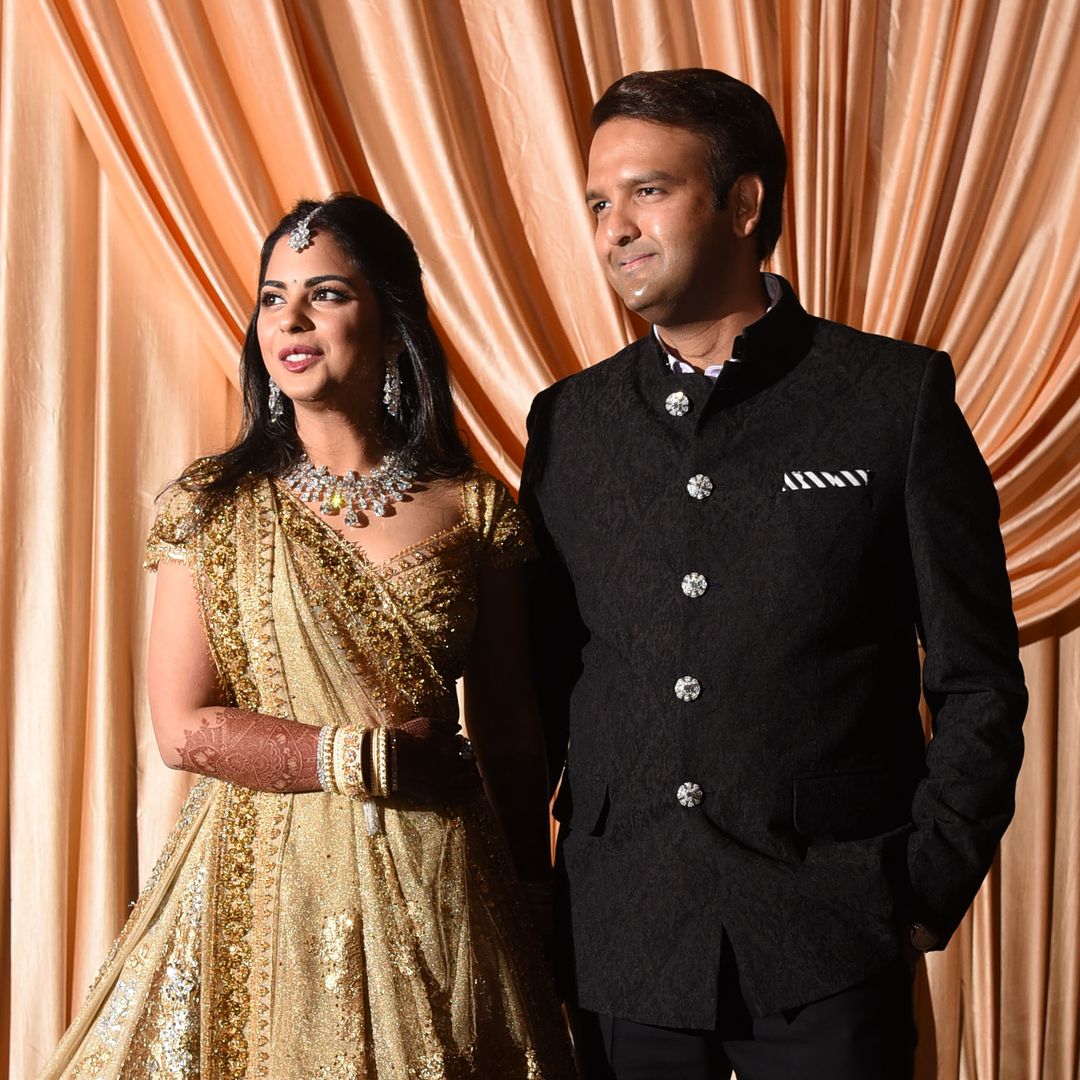 Isha Ambani, whose father is tycoon Mukesh Ambani, poses with Anand Piramal (R), son of Indian billionaire industrialist Ajay Piramal, during their wedding reception in Mumbai on December 14, 2018