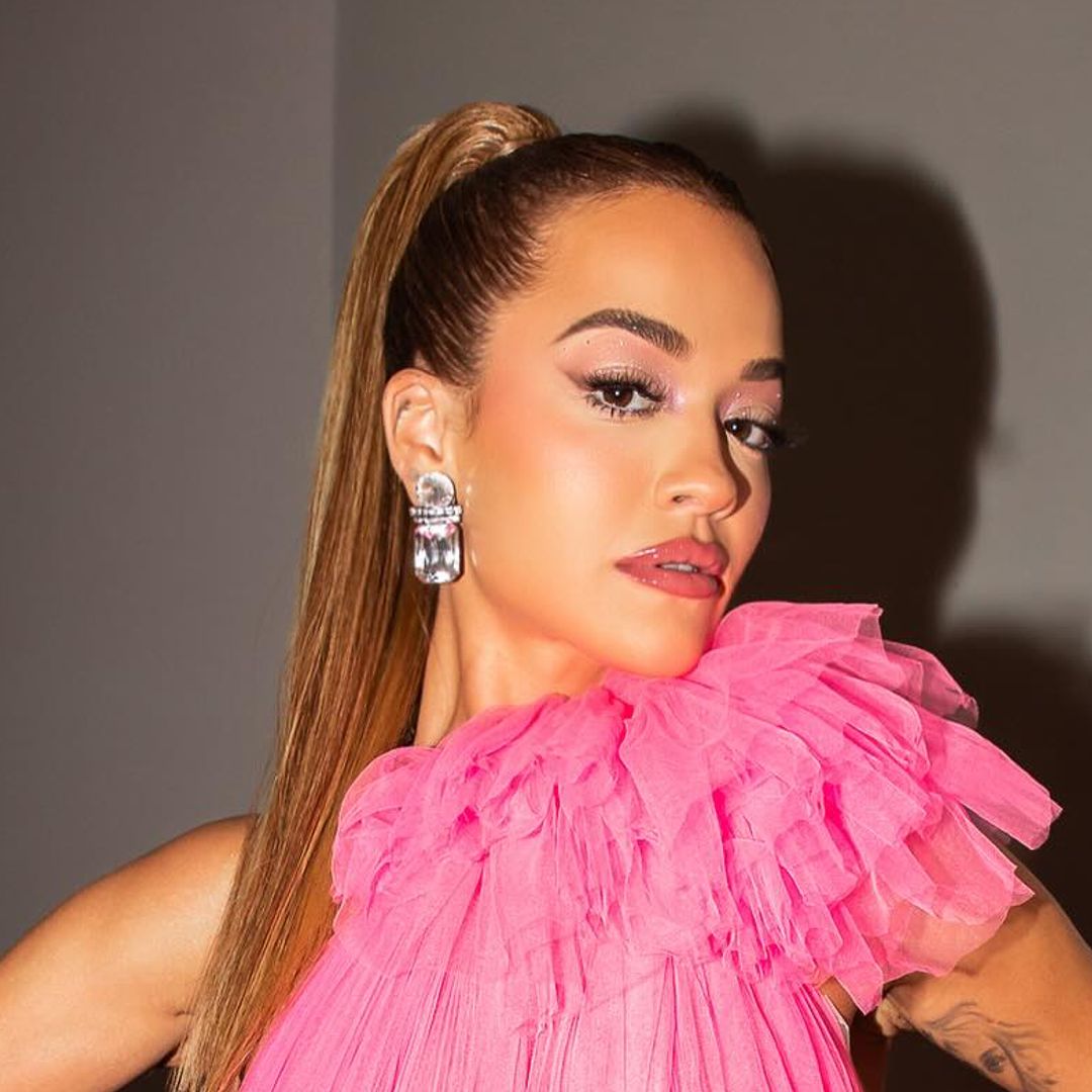 Rita Ora is giving 'cool-girl prom' vibes in a hot pink mini dress