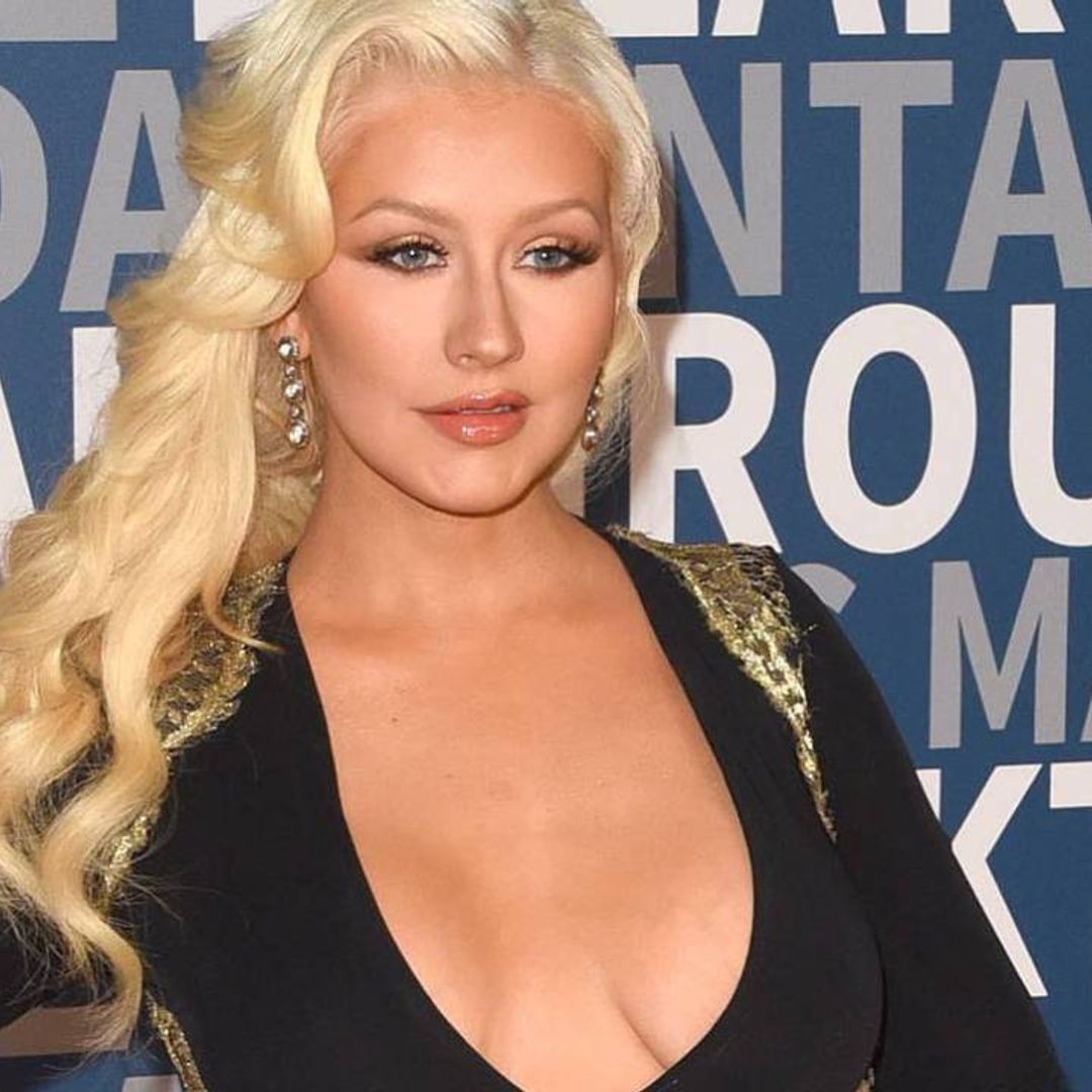 Christina Aguilera is a vision in high-cut white bodysuit