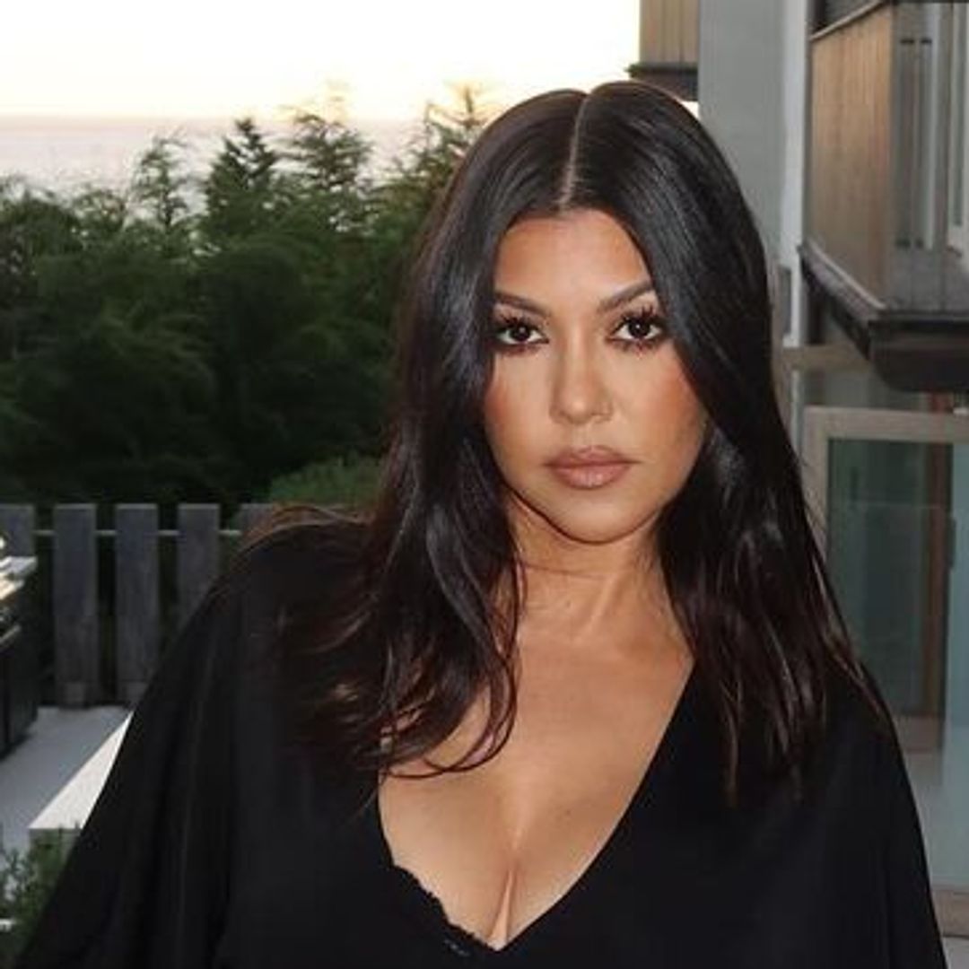 Kourtney Kardashian stuns in Morticia-inspired plunging black dress with eerie early Halloween decor in $10m LA home