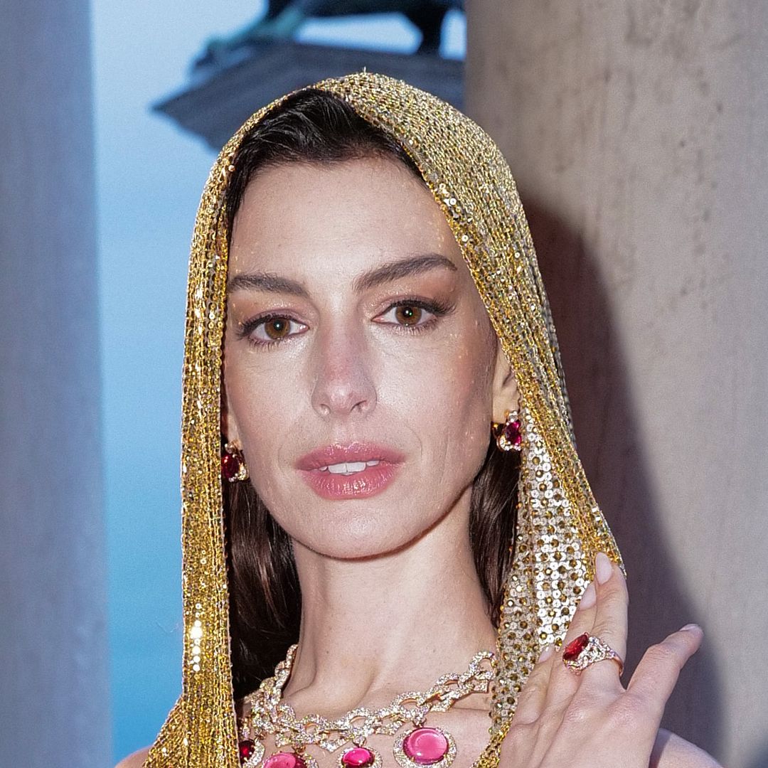Anne Hathaway bares her decorated chest in glittering gown at Bulgari event in Italy