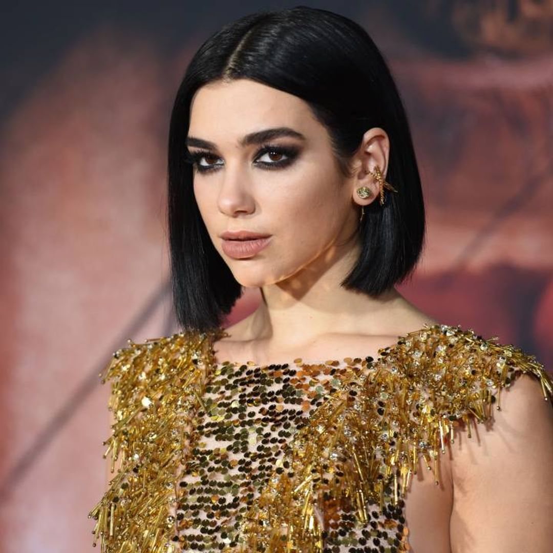 Dua Lipa wows in a glam lace-up crop top and massive heels Lady Gaga would love