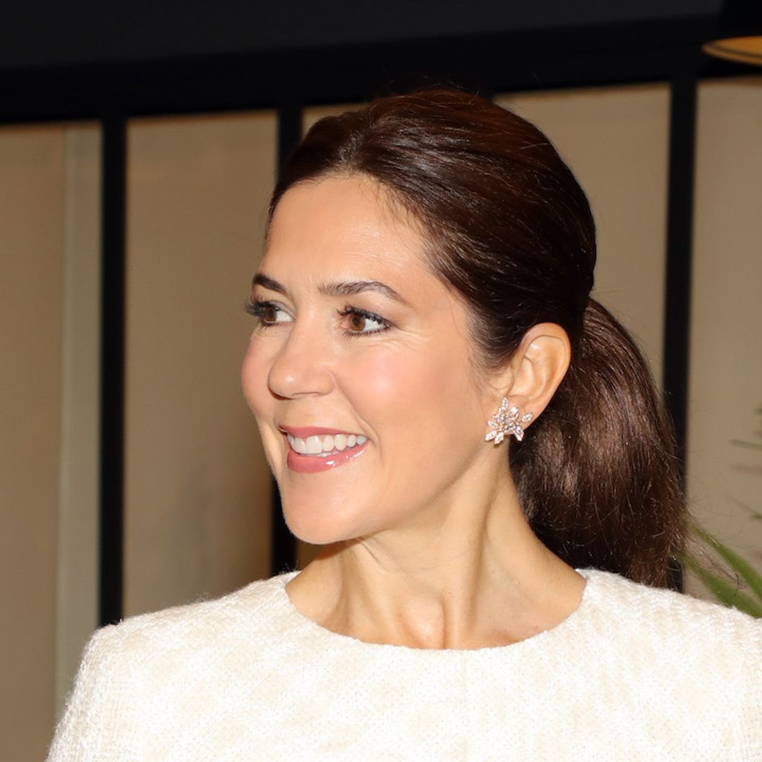 Crown Princess Mary looks like a royal bride again with white dress, bouquet and wedding diamonds