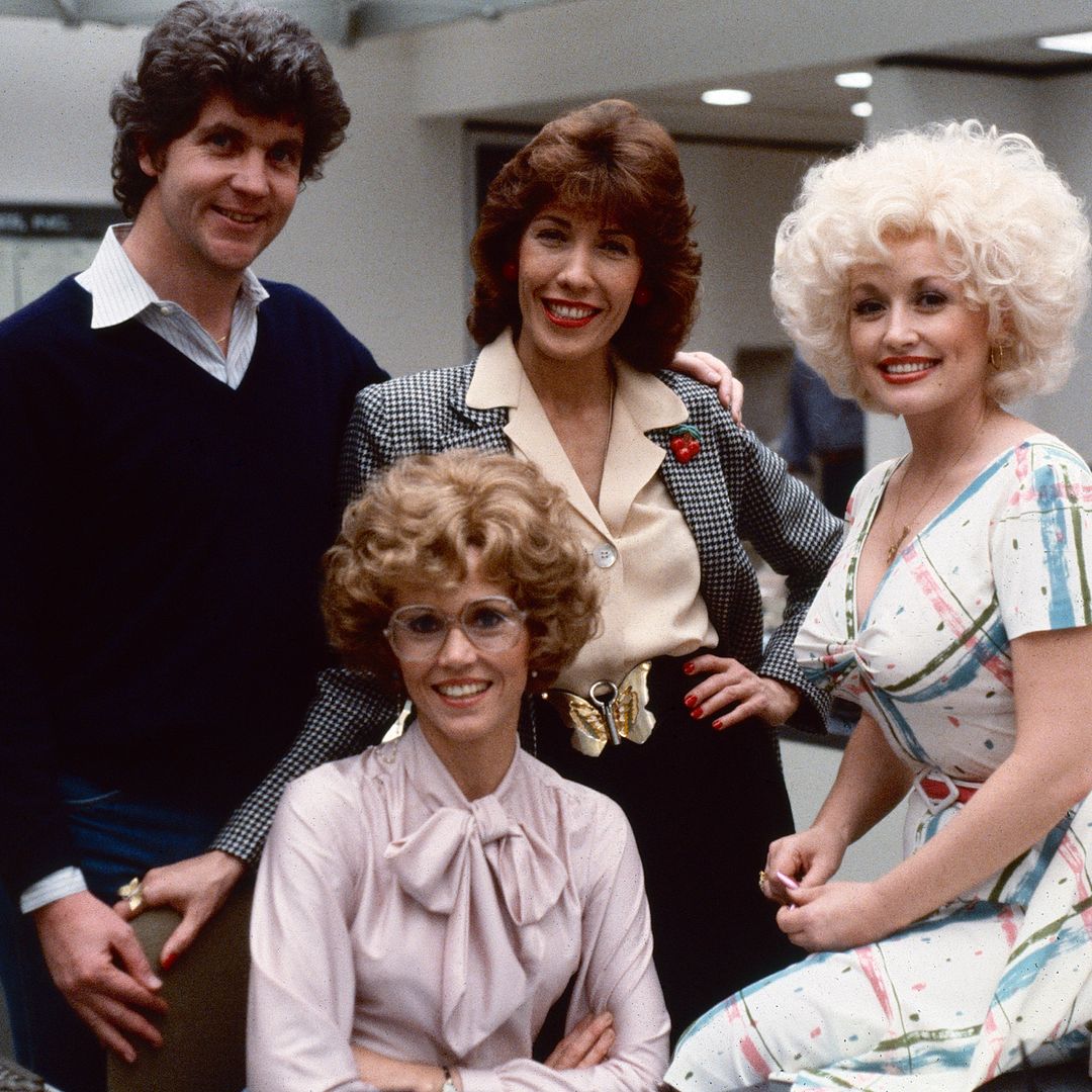 Portrait of, from left, Australian-American film director Colin Higgins (1941 - 1988), and American actors Jane Fonda (fore), Lily Tomlin (in checked blazer), and Dolly Parton on the set of the film '9 to 5' (also known as 'Nine to Five,' directed Higgins), Los Angeles, California, 1979.