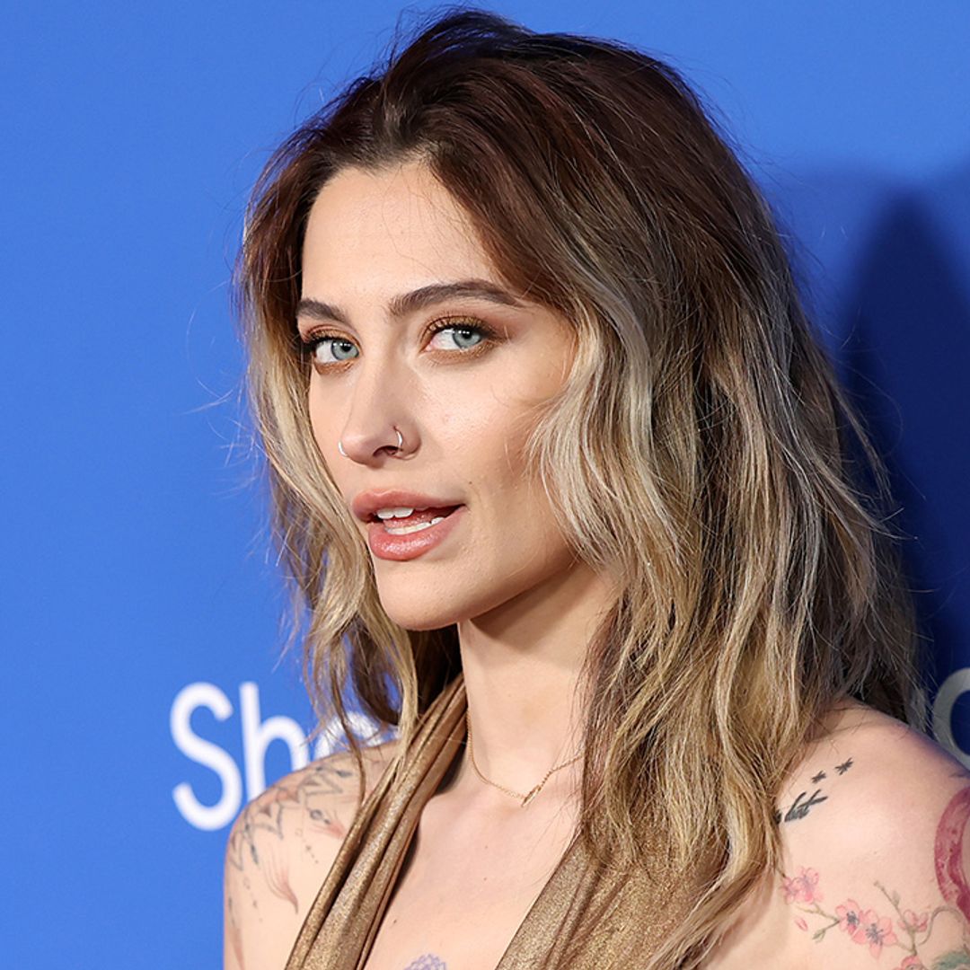 Paris Jackson exposes tattooed chest in plunging gown with daring thigh-split