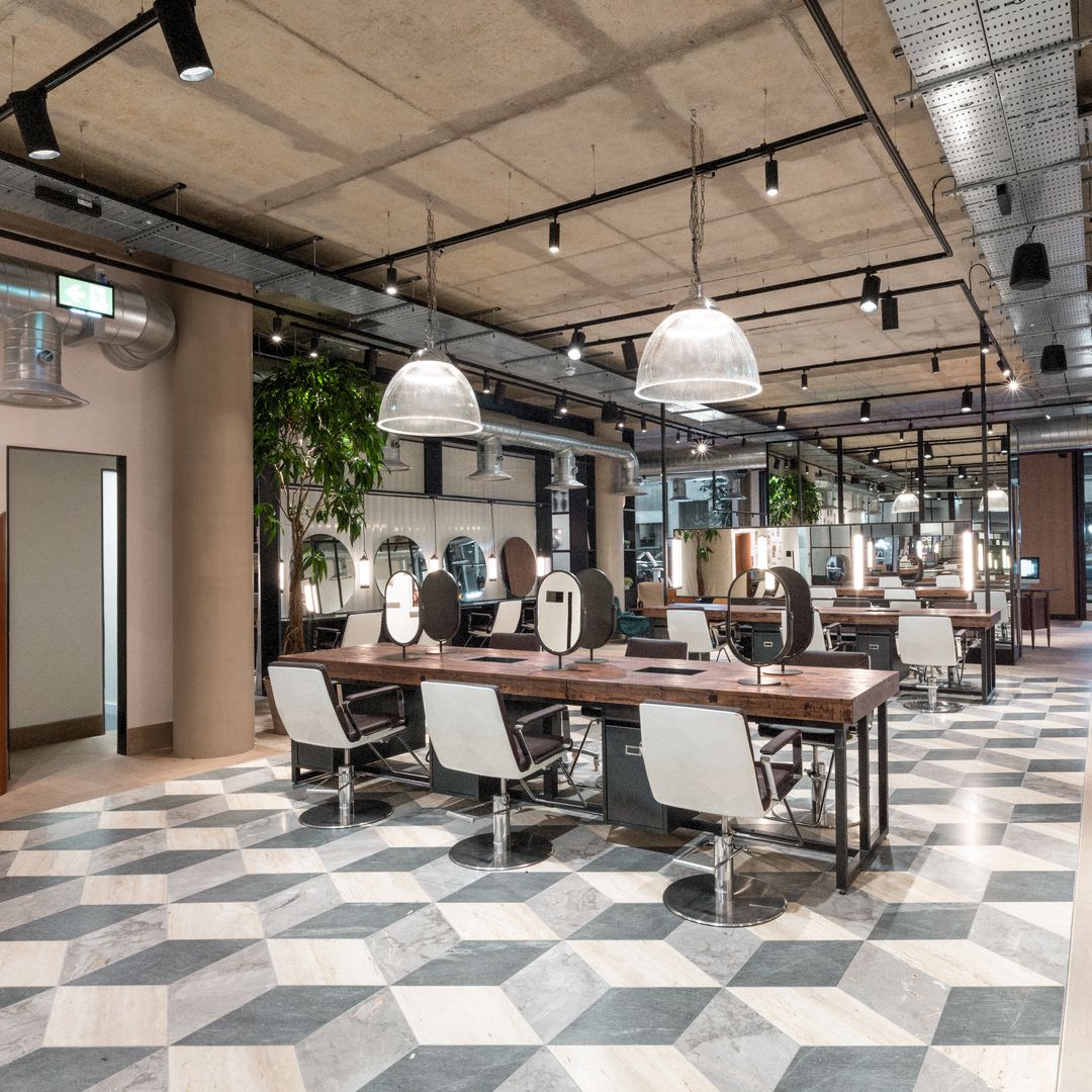 Hershesons hair salon with white chairs and geometric flooring