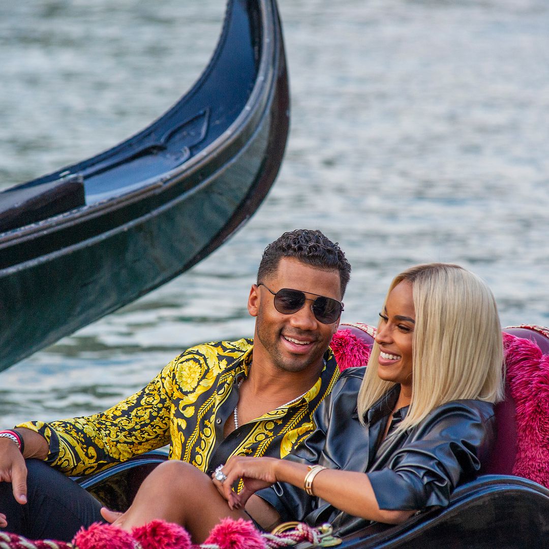 Ciara and Russell sat smiling on a gondola