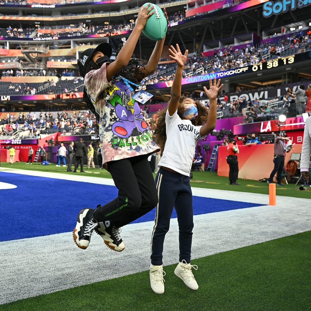 Football: Super Bowl LVI: Rapper Jay-Z daughter making catch with sister Rumi on sidelines before Los Angeles Rams vs Cincinnati Bengals game at SoFi Stadium. Inglewood, CA