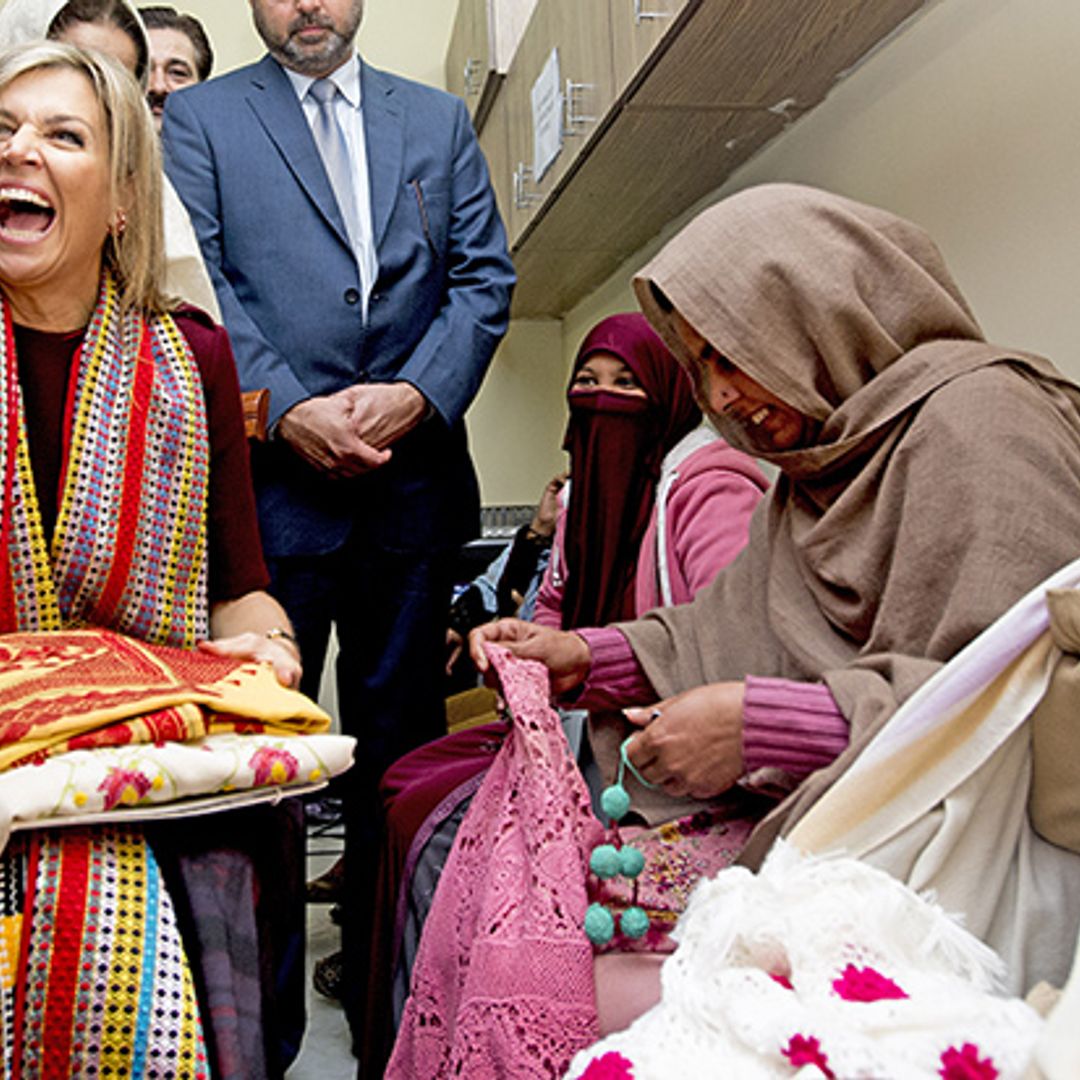 Flower power! Queen Máxima of the Netherlands is showered with roses during Pakistan visit