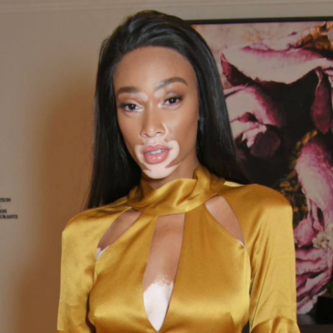 Winnie Harlow shimmers in a metallic gold dress at a fundraising dinner in London