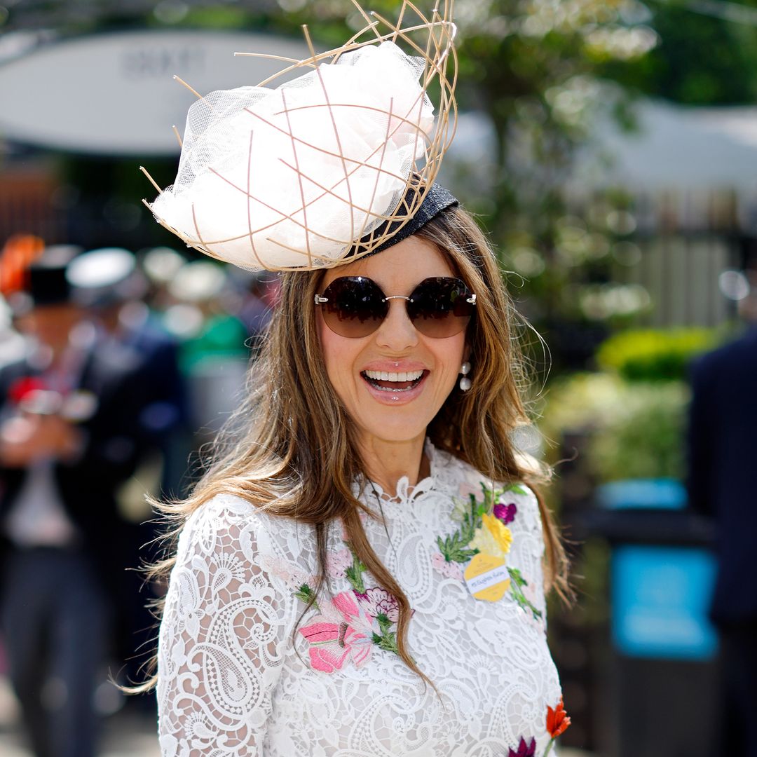Elizabeth Hurley steps out in figure-hugging lace dress and daring fascinator for exciting day out