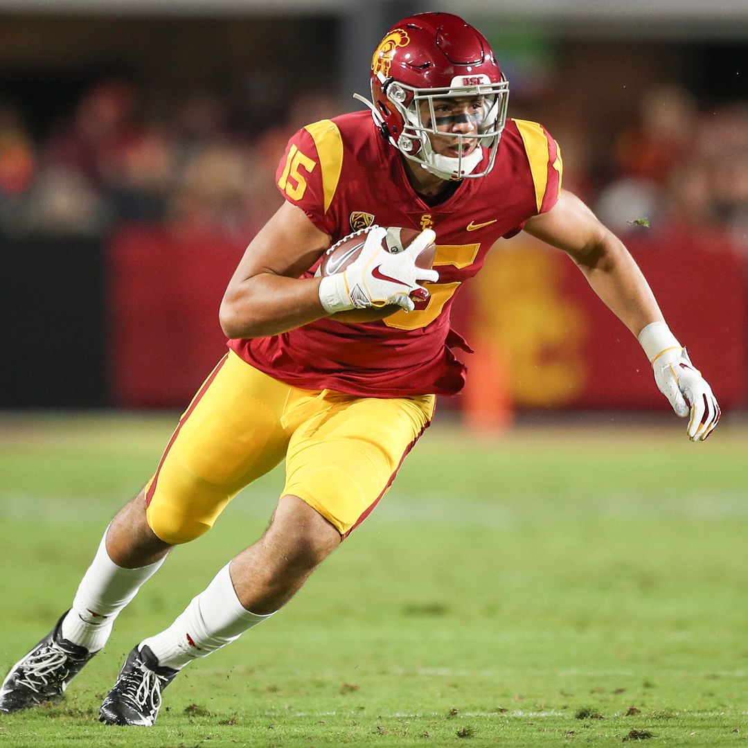 Wide receiver Drake London #15 of the USC Trojans carries the ball against the Arizona Wildcats at Los Angeles Memorial Coliseum on October 19, 2019 in Los Angeles, California.