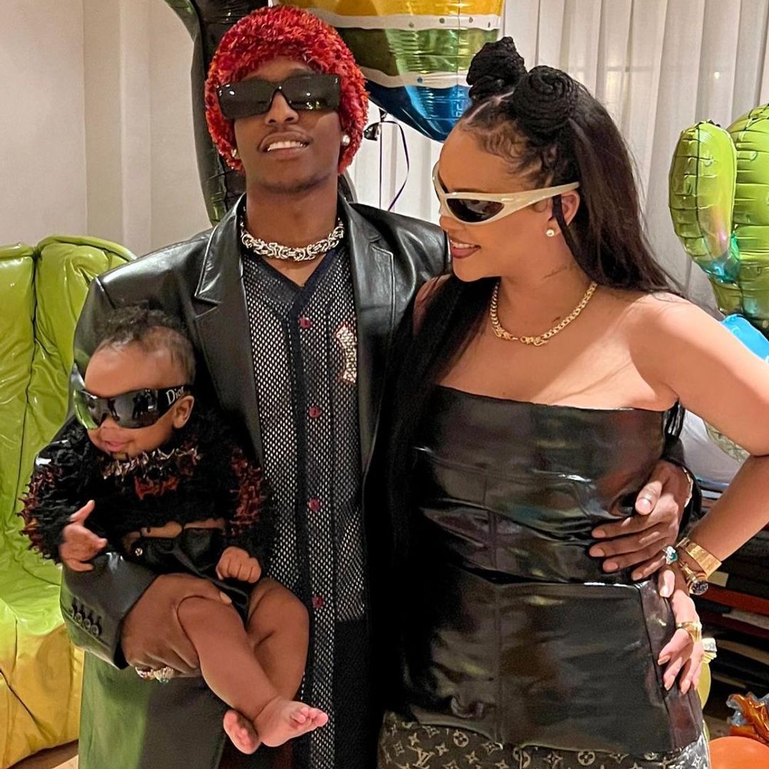 ASAP stood with Rihanna, he is holding his son in his arms, they are all wearing sunglasses