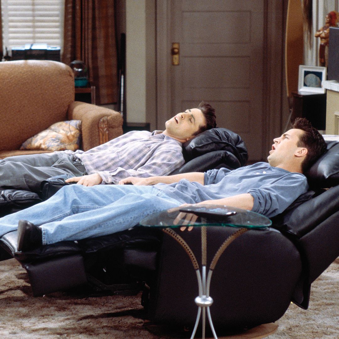 Chandler and Joey relaxing in their apartment