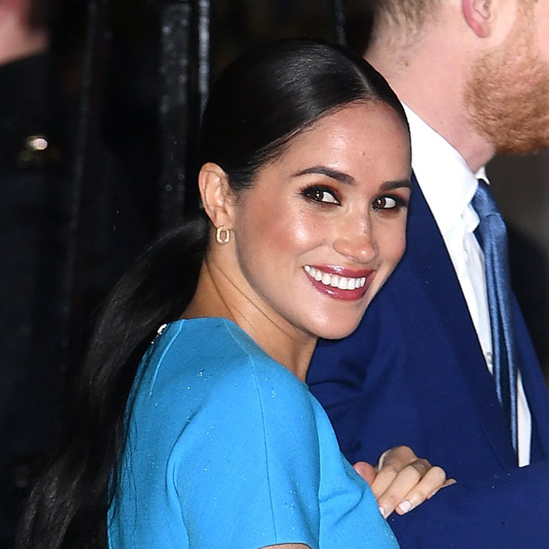 Meghan Markle wears a gorgeous blue Victoria Beckham dress for her stylish return to the UK