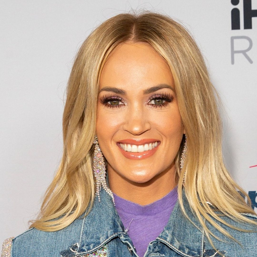 Carrie Underwood celebrates during Vegas residency in tasseled silver bodysuit
