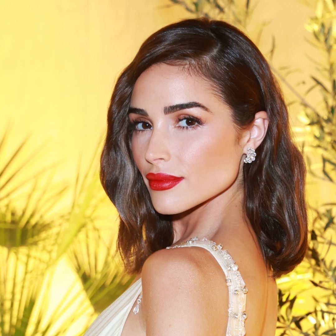 Olivia Culpo shows off her endlessly toned legs in skirt with dangerously high slit