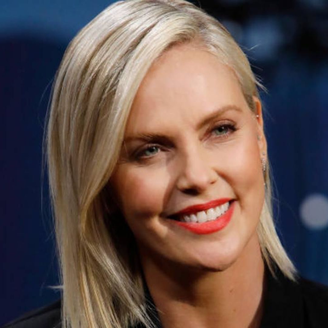 Charlize Theron has legs for miles as she poses in just a T-shirt