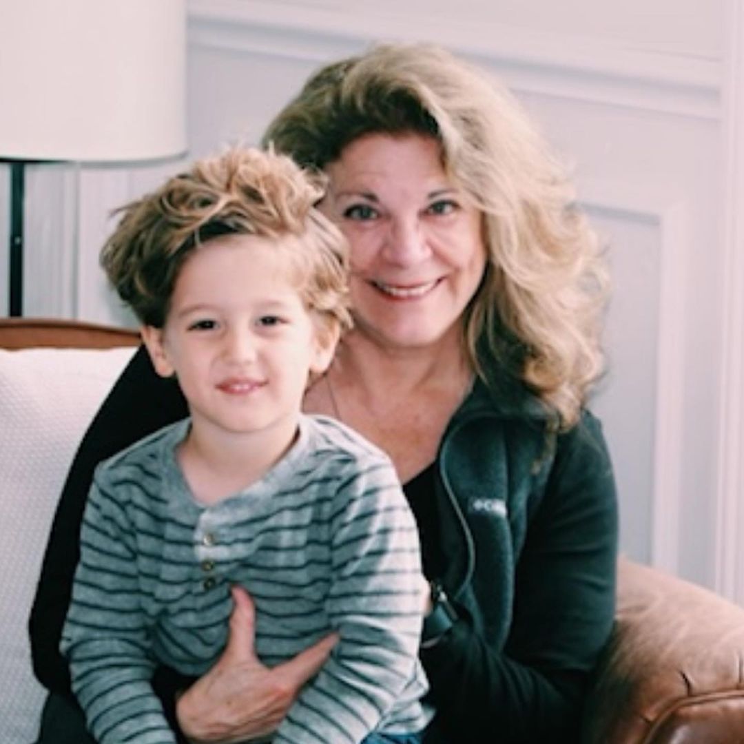 Ginger Zee's mom smiling with her grandson on her lap