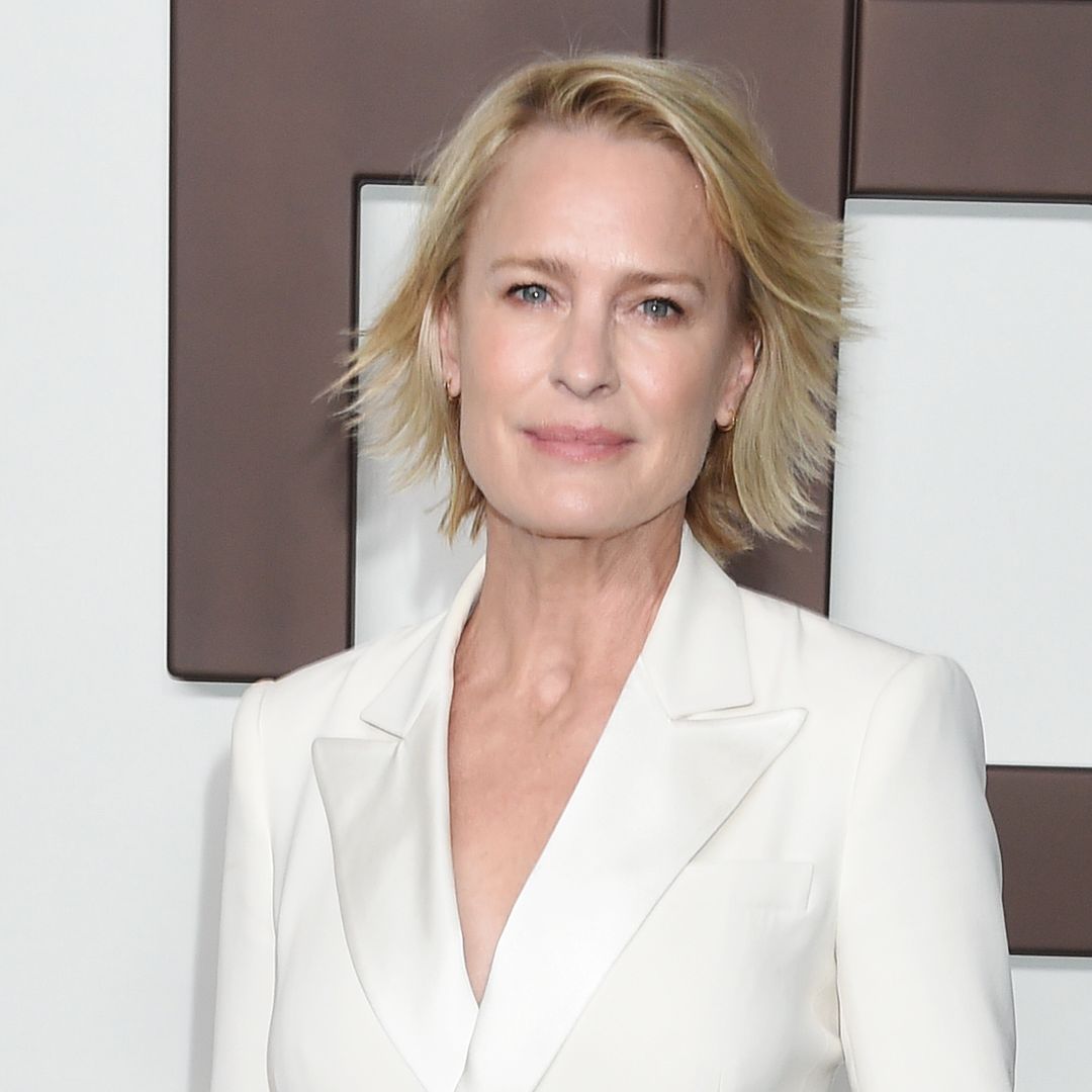 Robin Wright looks as ethereal as ever in a plunging fitted white floor-length dress from rare high-profile outing
