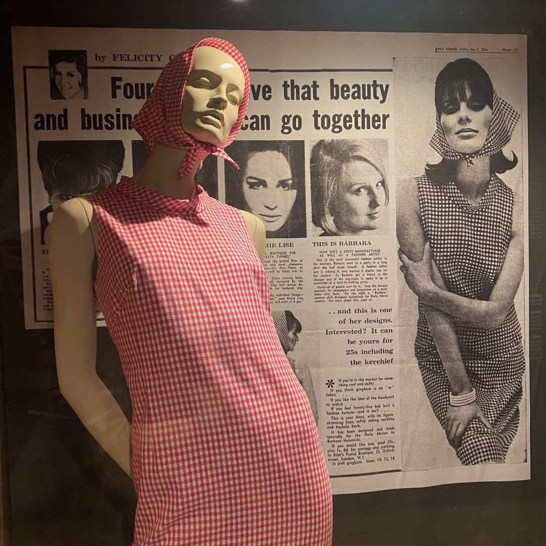 Mannequin wearing a gingham dress 