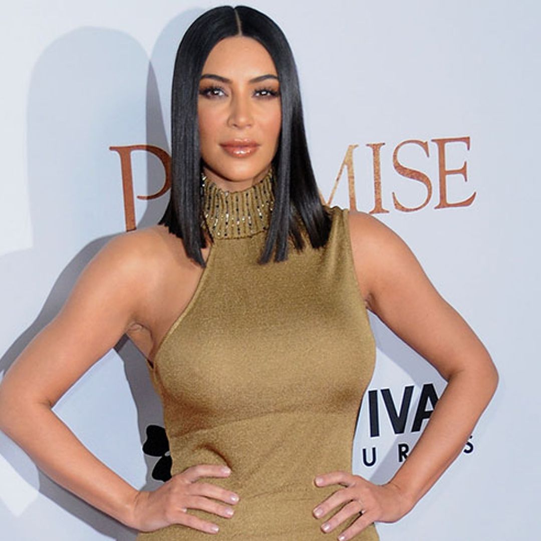 Kim Kardashian wears a skin-tight gold dress to The Promise premiere