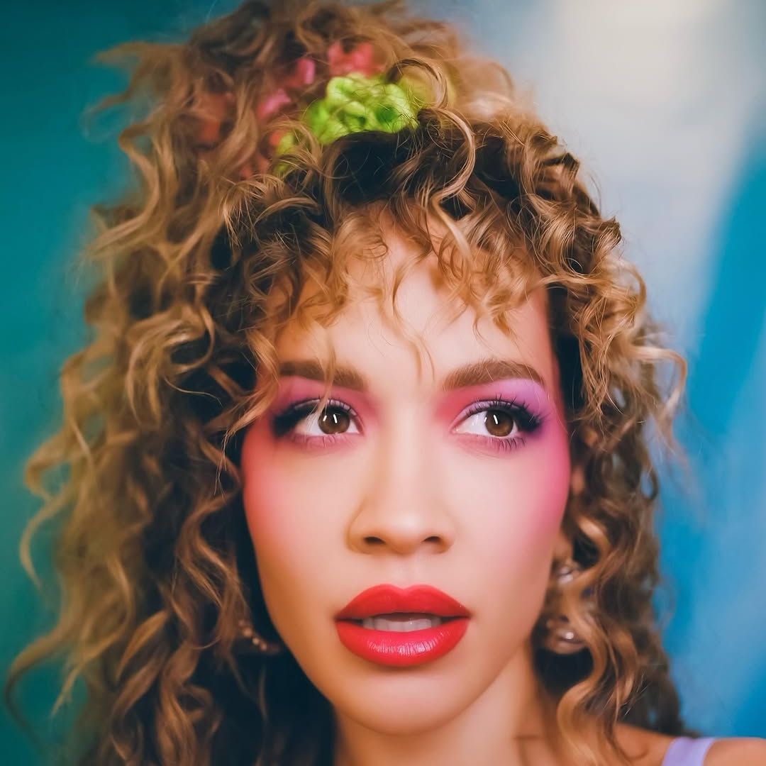 Rita Ora with pink blush, eyeshadow and coral lips 