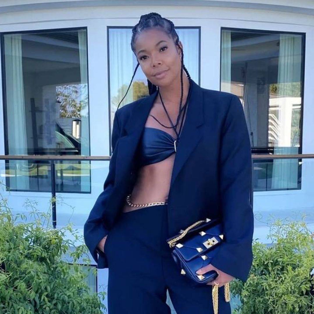 Gabrielle Union wows in a leather bra top for flirty poolside photo