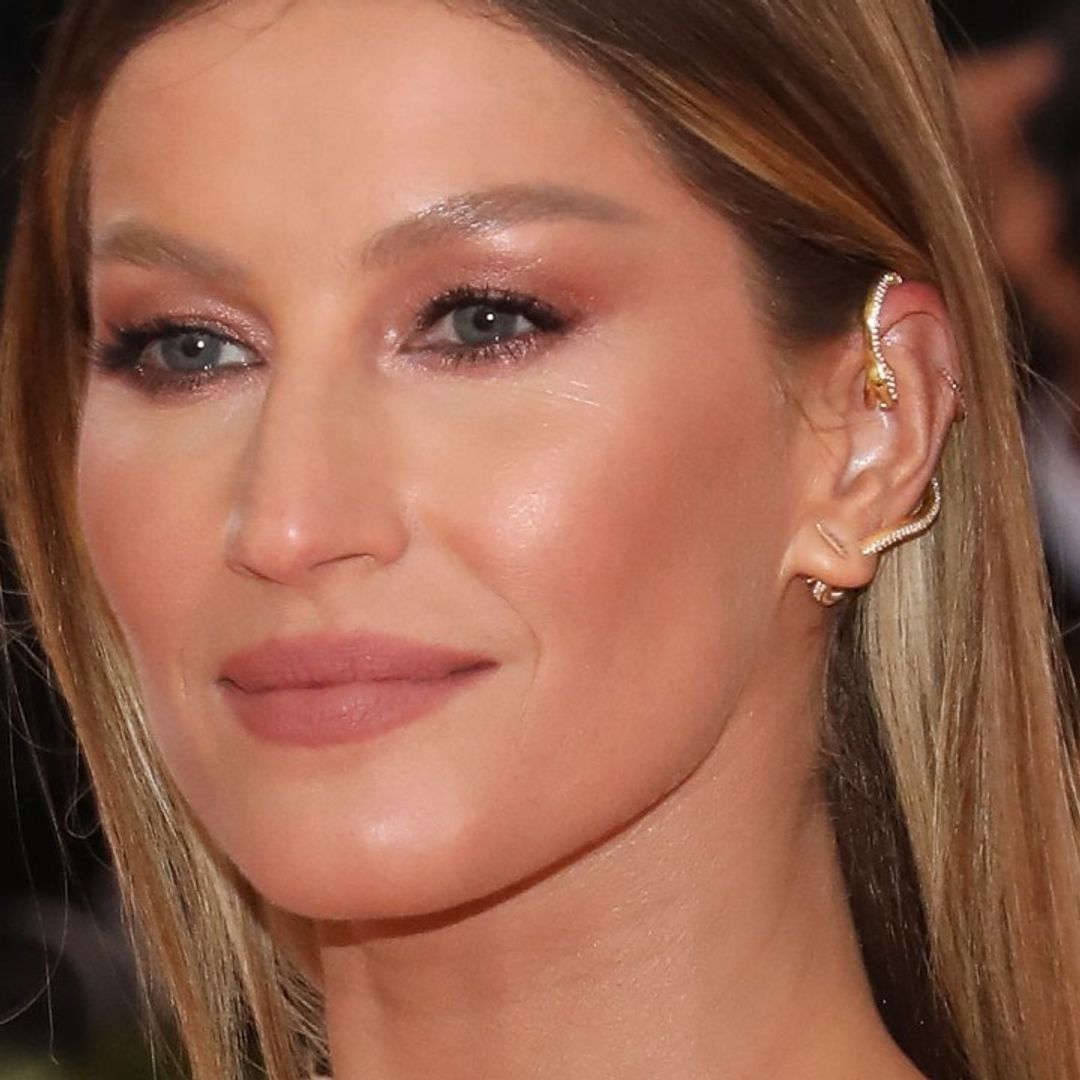 Gisele Bundchen looks fabulous in eye-catching metallic gown as she steps out at glitzy event