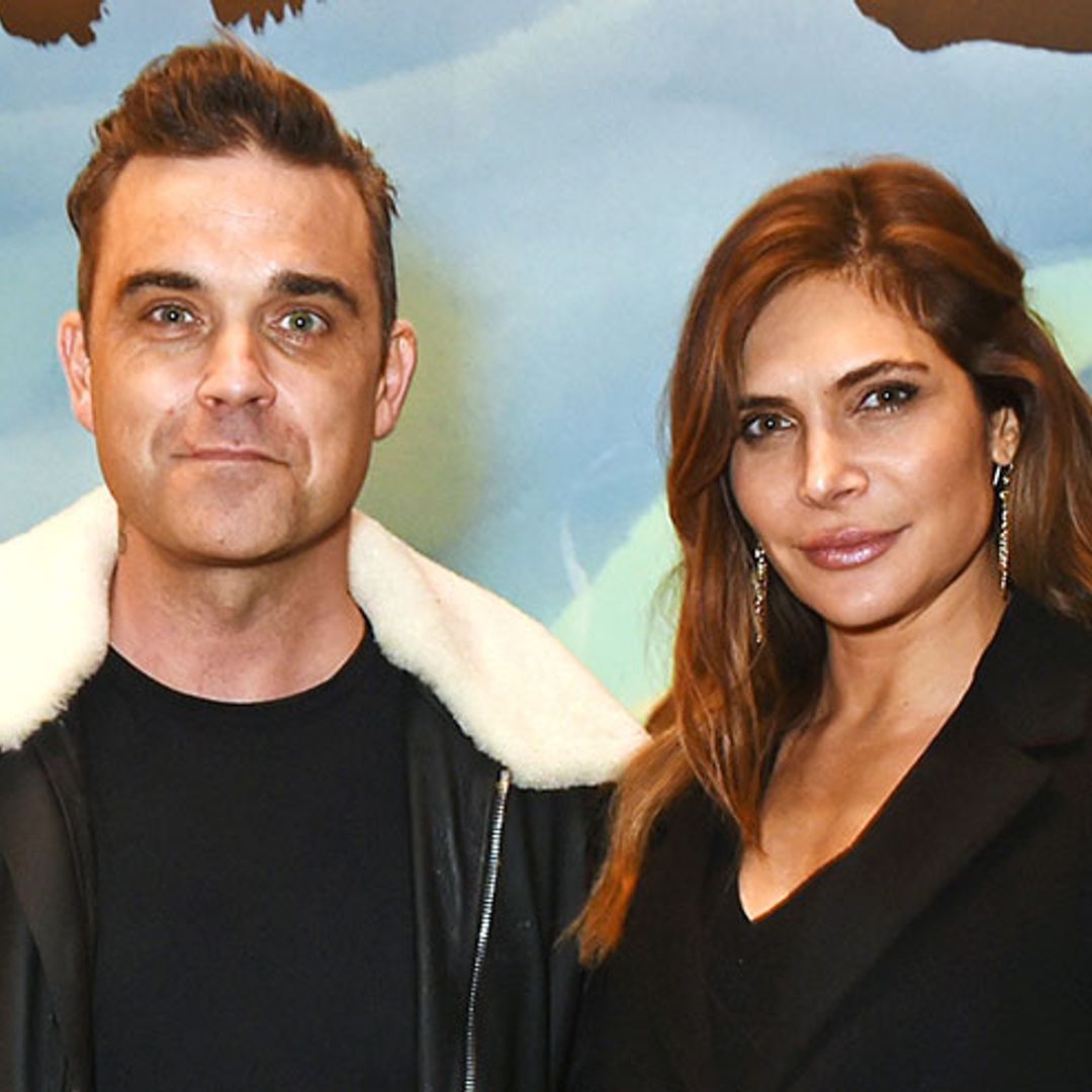 Robbie Williams and Ayda Field's children enjoy splashing in puddles on a rainy day