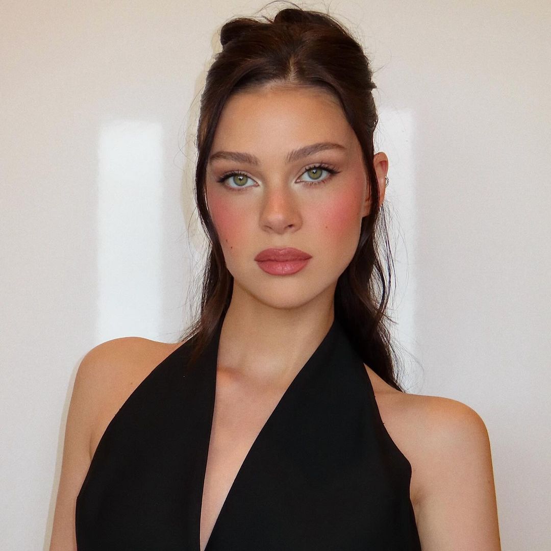 Nicola Peltz's plunging top is a Victoria Beckham signature