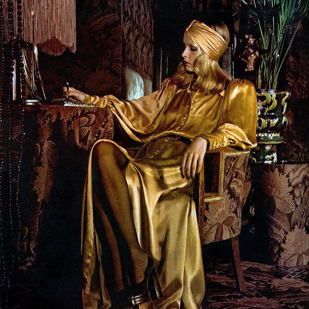 Twiggy in a golden dress in the Biba fashion store for an article about the designer Barbara Hulanicki in British Vogue, December 1973