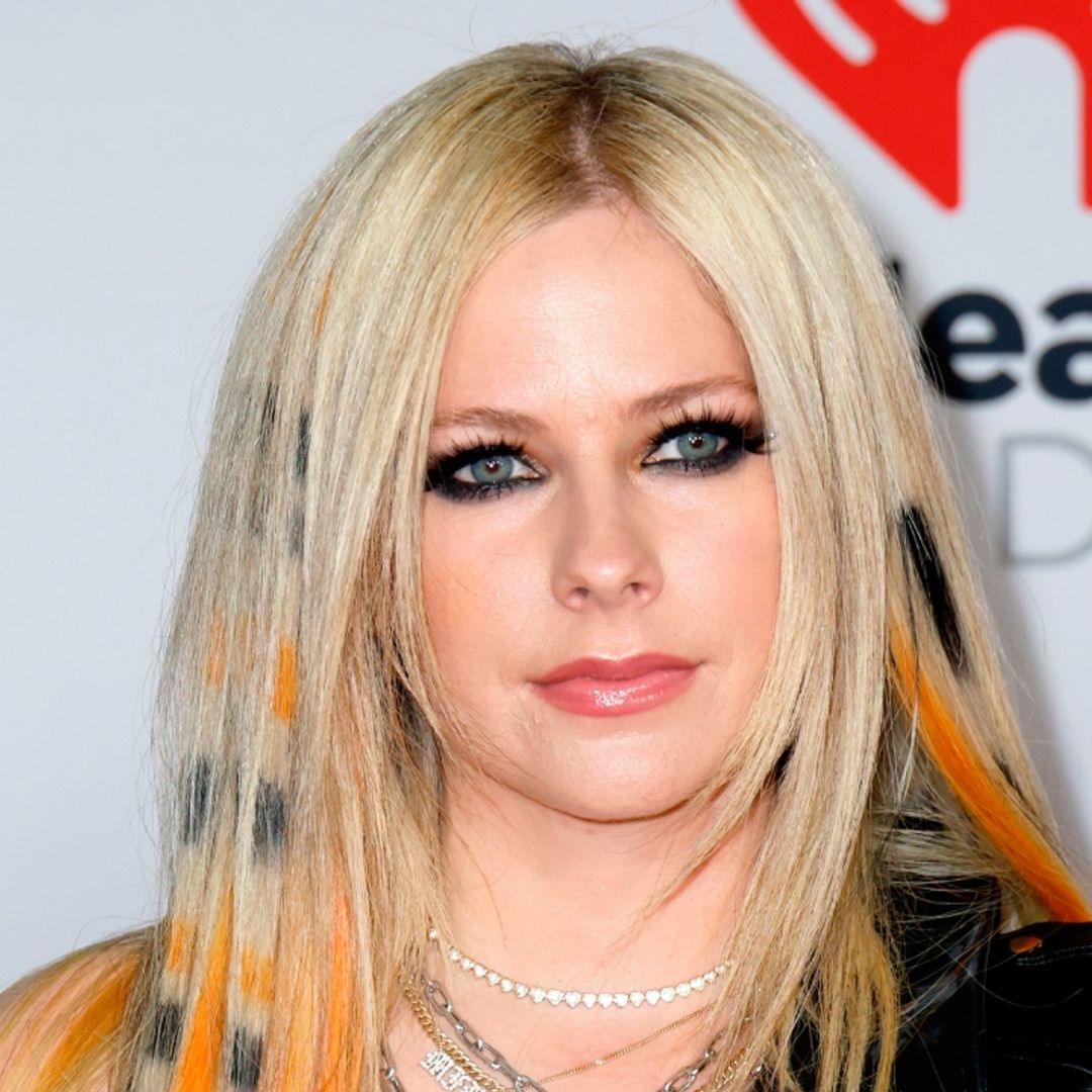 Avril Lavigne is all punk couture in leather little black dress with this unexpected detail