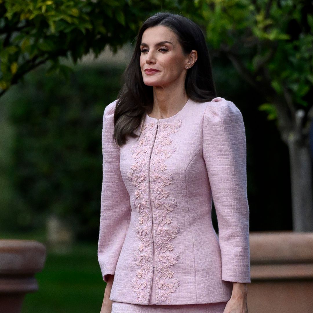 Queen Letizia stuns in bridal white shirt and waist-cinching skirt