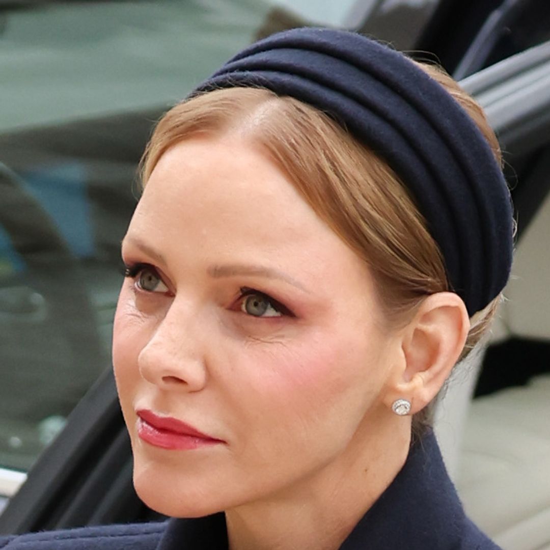 Princess Charlene is angelic in crispest white coat