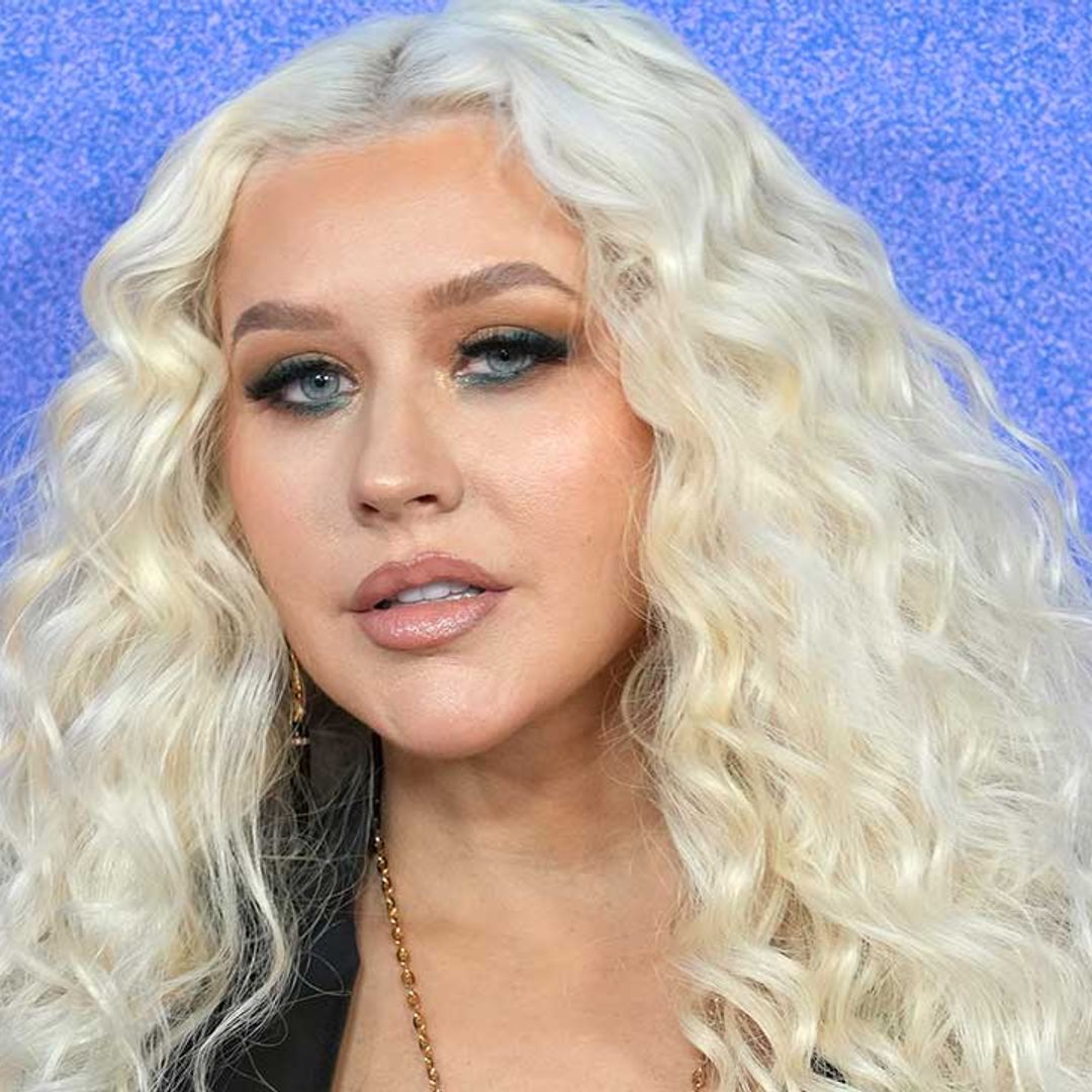 Christina Aguilera displays her decorated chest in revealing new outfit