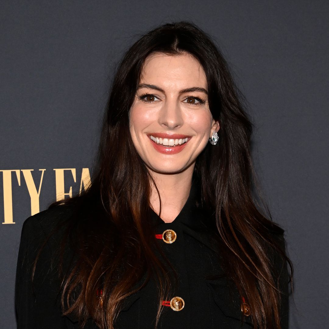 Anne Hathaway's mini skirt and knee-high boots combo is a date night dream