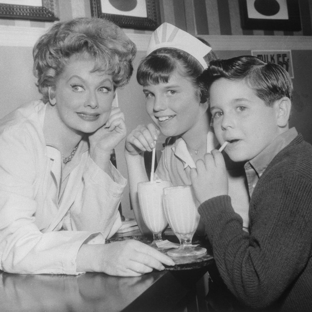 Comedienne Lucille Ball takes a break on a Hollywood TV film set to play hostess to her own youngsters at a movie "soda fountain." Daughter Lucie Arnaz was making her acting debut with her mother in the Lucy Show to be shown on the CBS-TV network on March 4th. Son Desi Arnaz Jr., was just visiting this time.