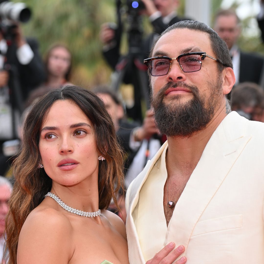Jason Momoa and girlfriend Adria Arjona pack on the PDA on red carpet