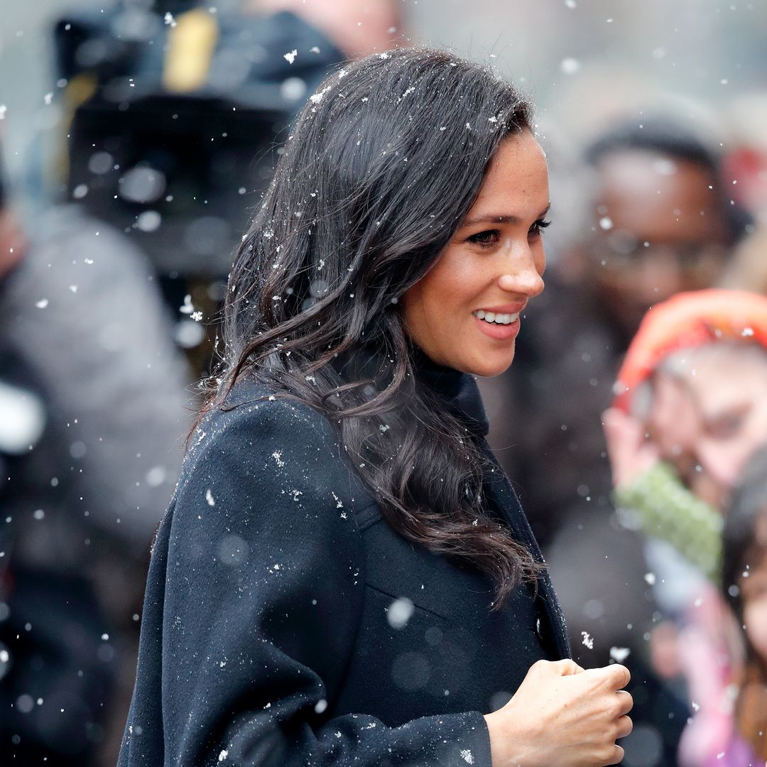 Meghan Markle nails ski-girl chic in black and blue puffer jacket with skinny jeans